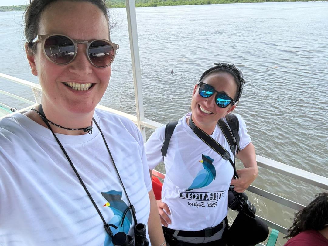 Two travellers smiling on a boat on the Nile